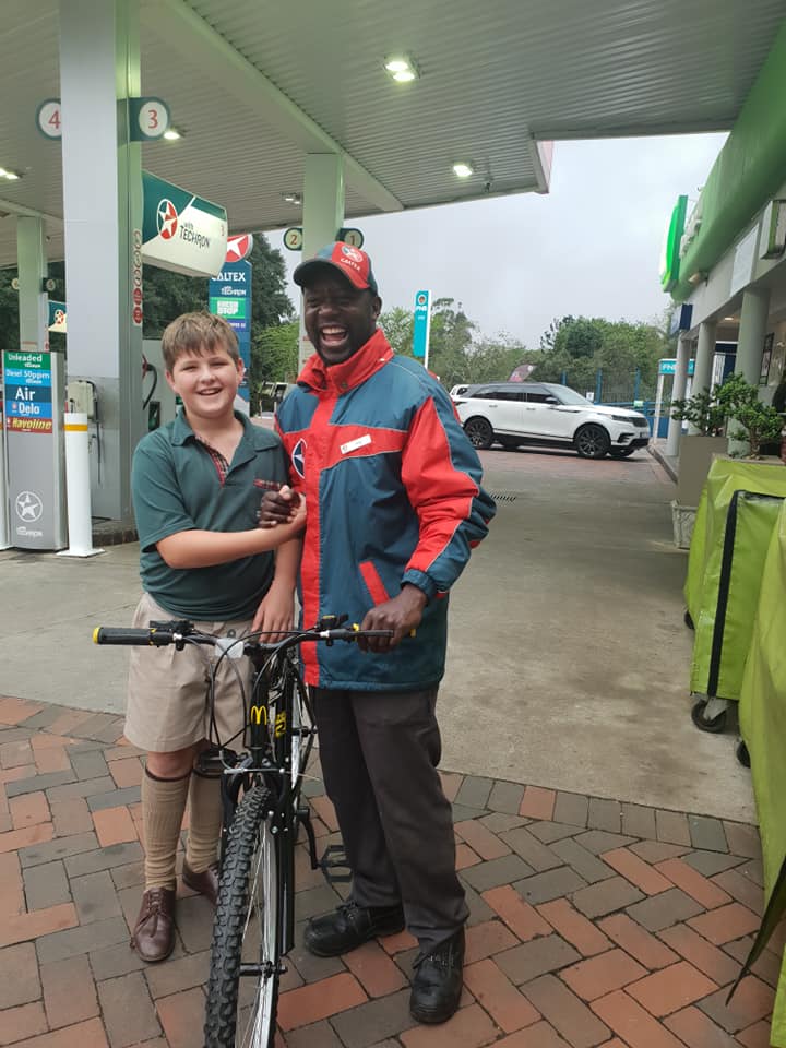 boy buys gas station worker bike