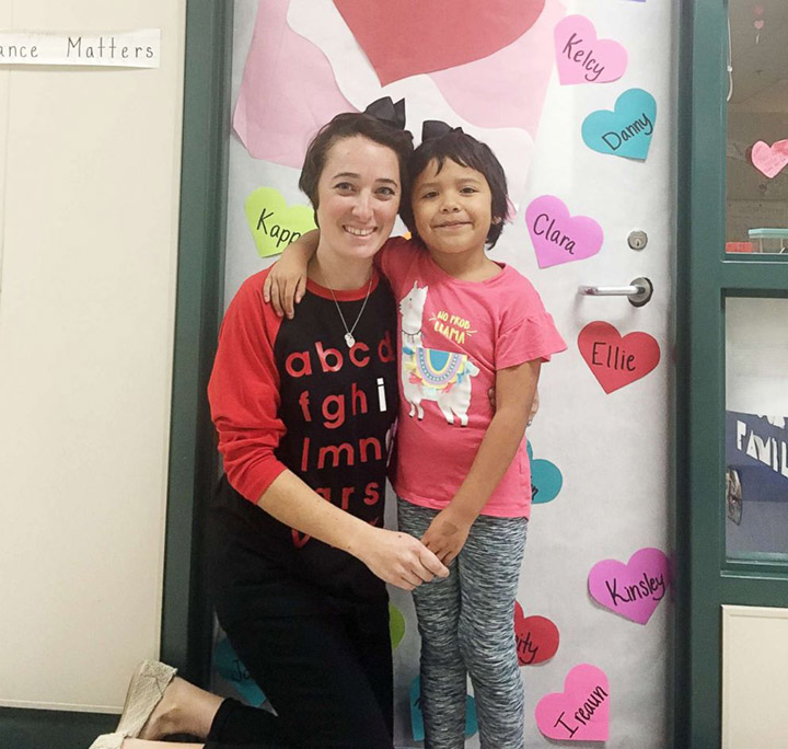 teacher Grimm cuts hair for student