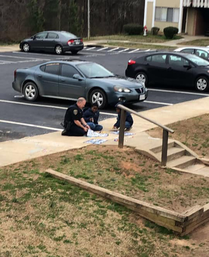 cop plays dolls with girls