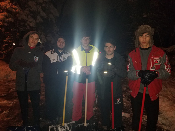 high school students shovel driveway at 4 am