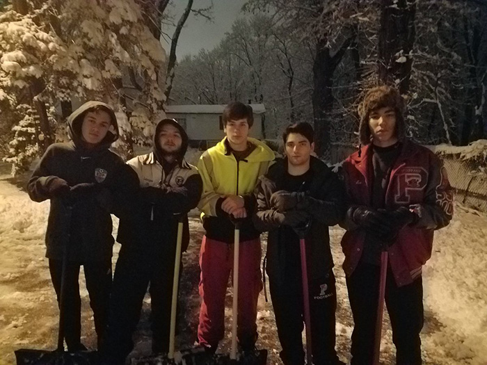 high school students shovel driveway at 4 am