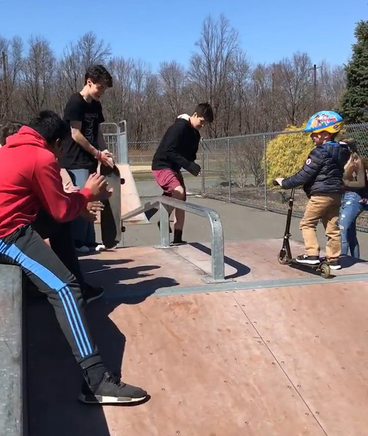 teens teach kid autism to skate