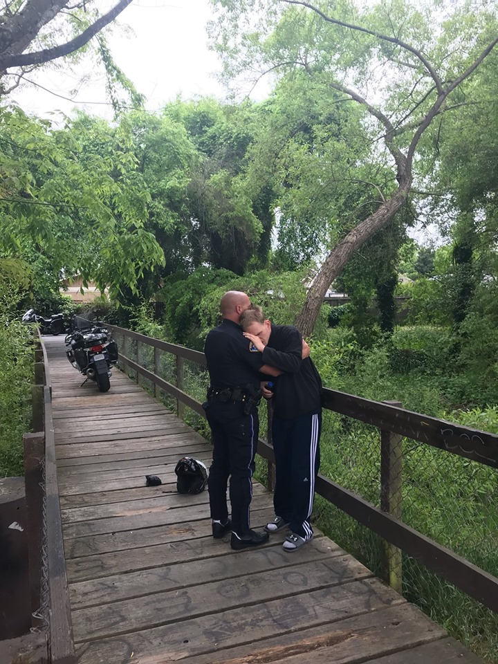 police officer hugs missing person
