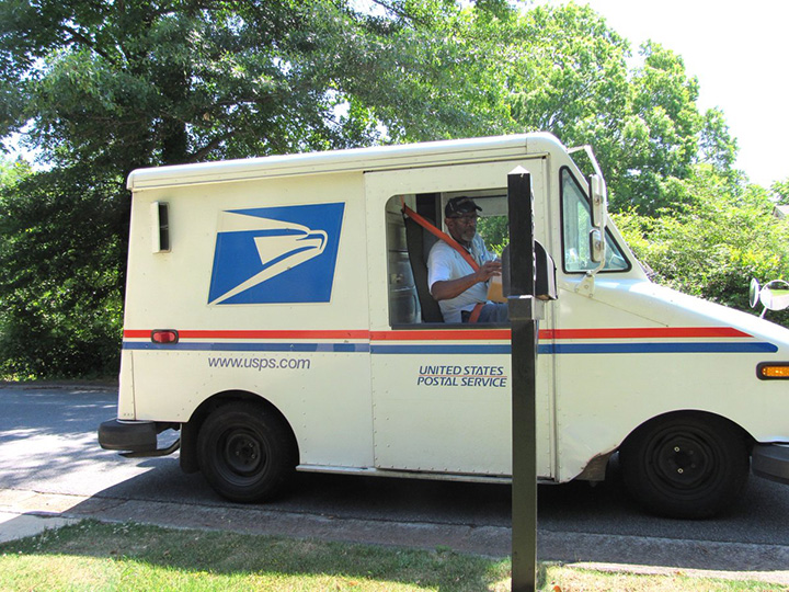 neighborhood throws mailman retirement party