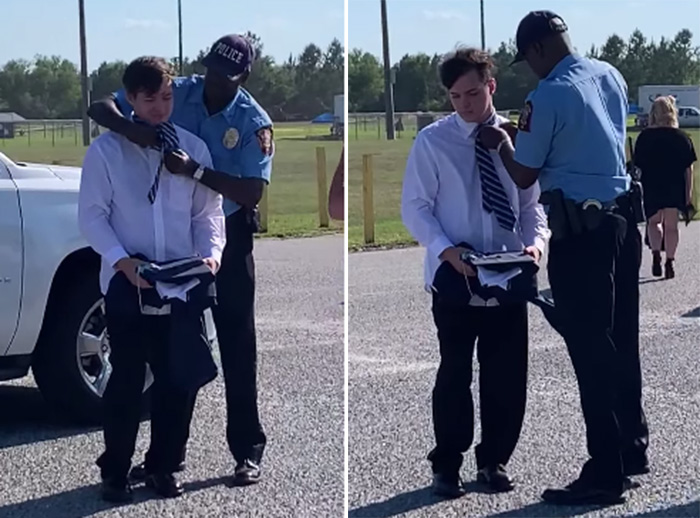 officer helps student with tie