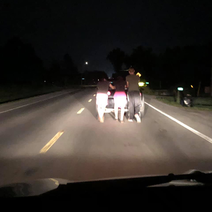 teens push car 5 miles