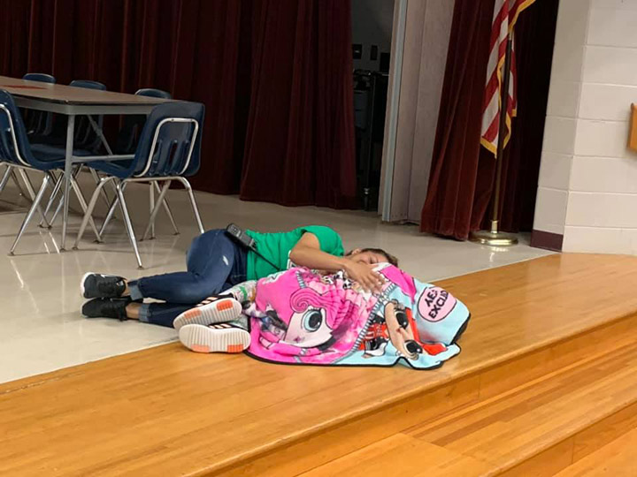 janitor lays down with student comfort