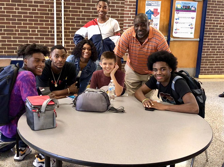 football team eats with bullied kid