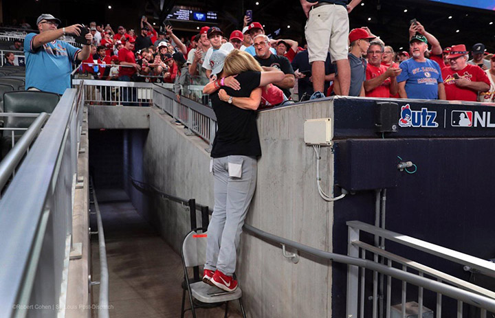 pitcher hugs mom after win