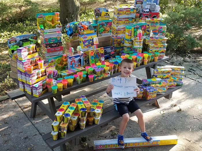 boy donates toys to hospital