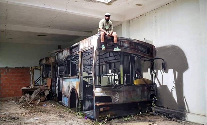 man turns wall block into bus street art