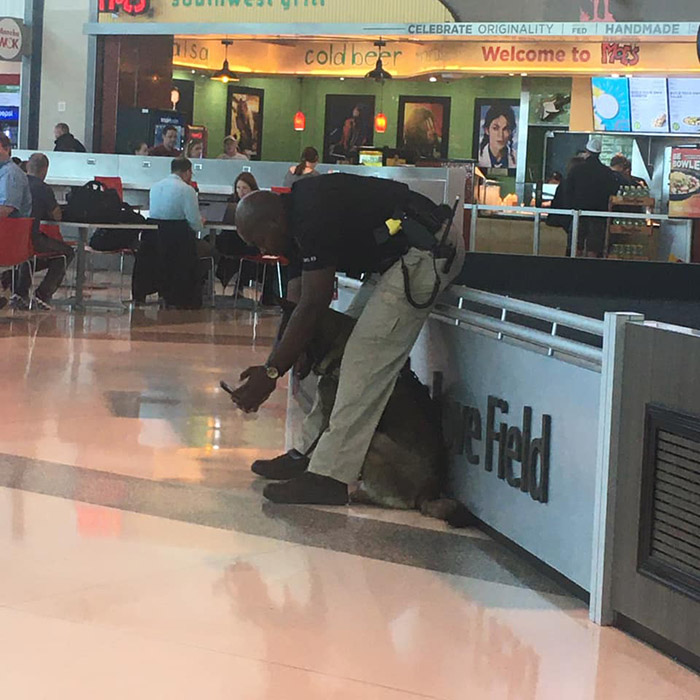 police officer selfies with dog and shows him airport dallas