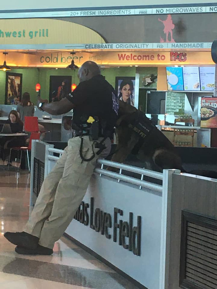 police officer selfies with dog and shows him airport dallas