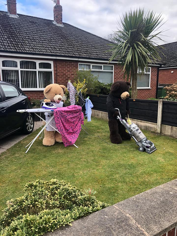 man poses giant bears to bring smiles