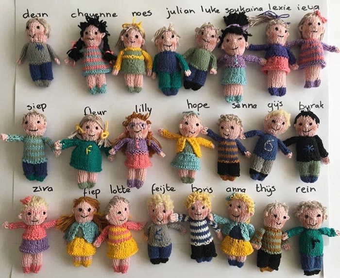 teacher knits dolls of students