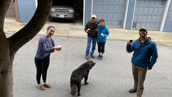 man hands out free coffee to workers