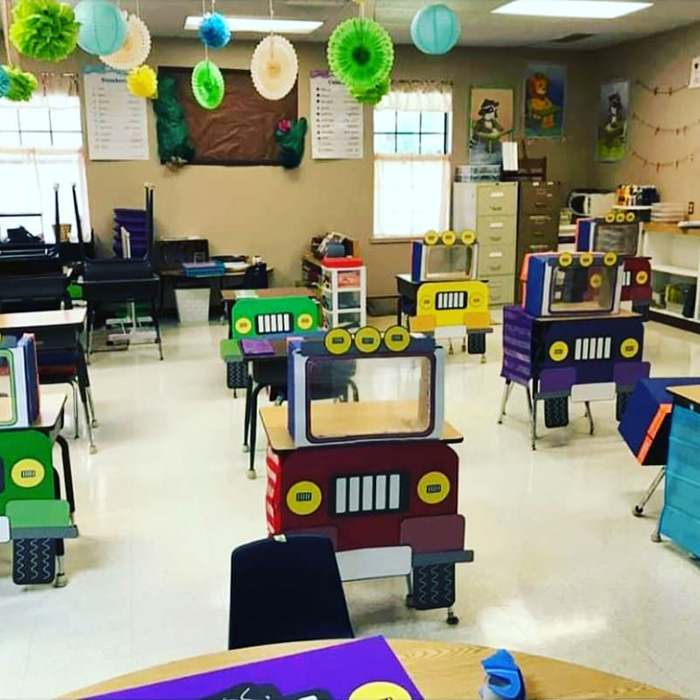 teacher creates social distancing desks for kids