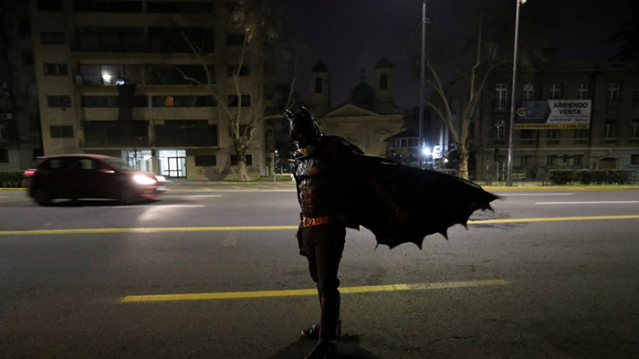 batman feeding homeless in Chile