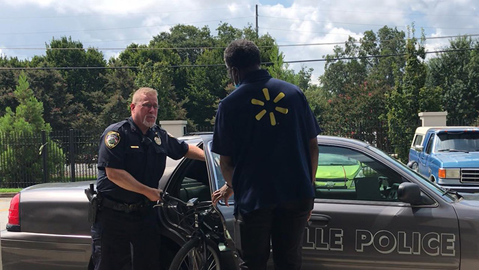 officer gives man bike