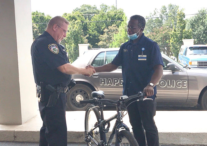 officer gives man bike