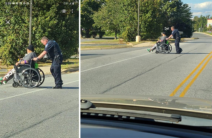 officer pushes man in wheelchair across street