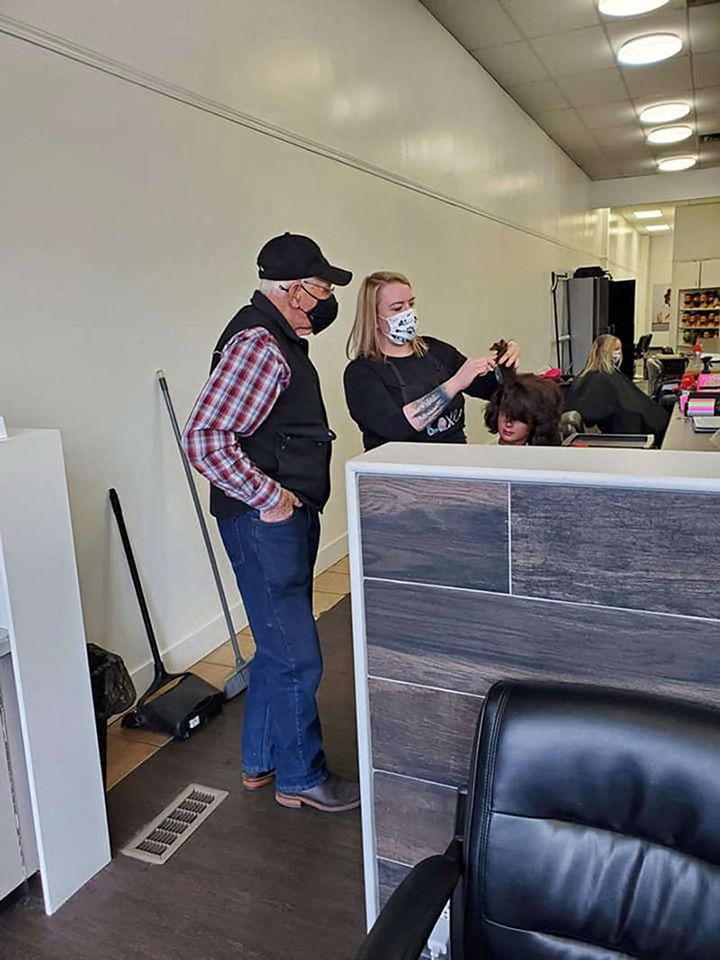 elderly man attends beauty school to help wife