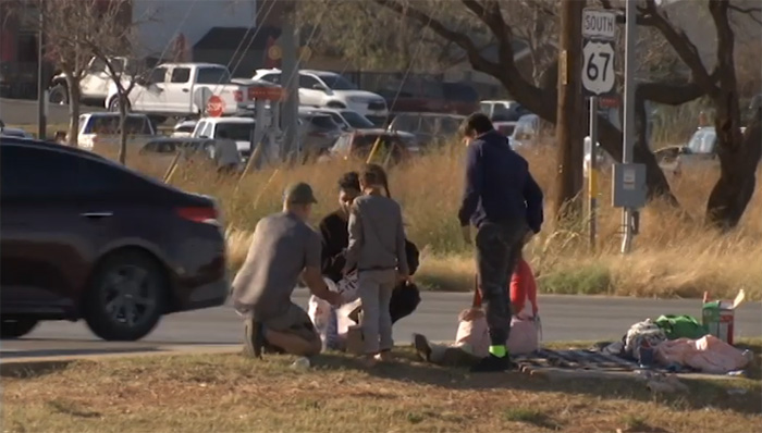 man brings food to family in need