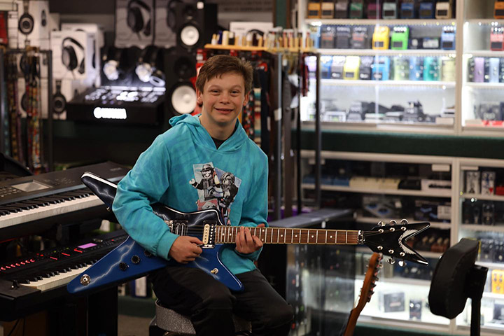 shopper buys kid guitar