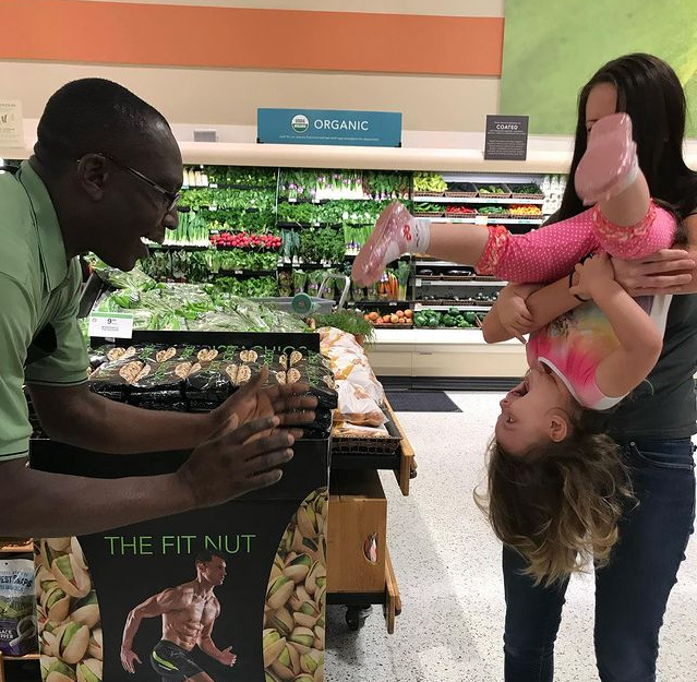 little girl and grocery store employee bike