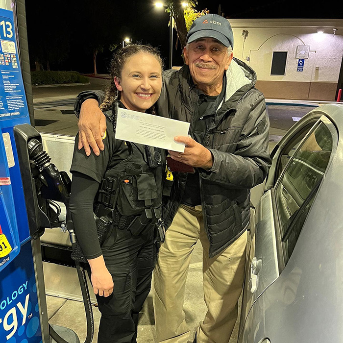 police surprise people at pump free gas money