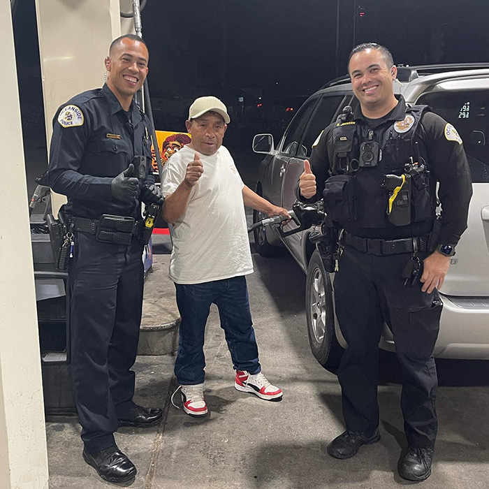 police surprise people at pump free gas money