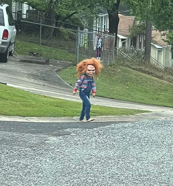 kid dressed like Chucky in street