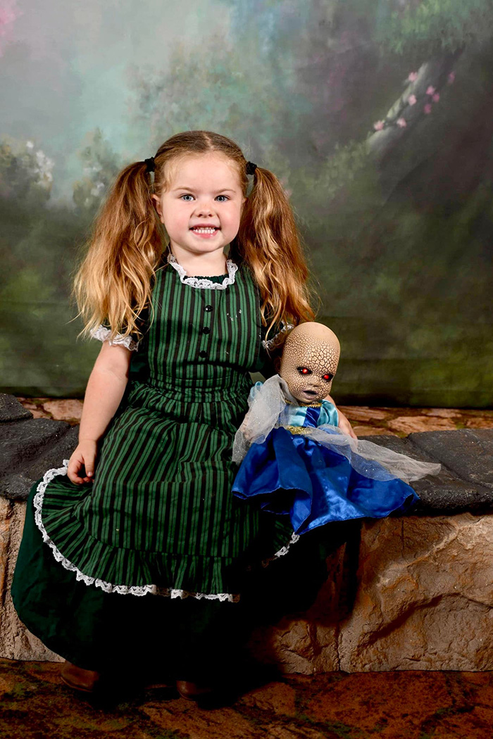 little girl loves her creepy doll