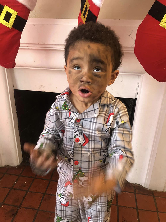 boy climbs chimney looking for Santa