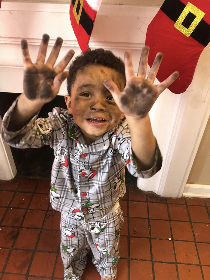 boy climbs chimney looking for Santa