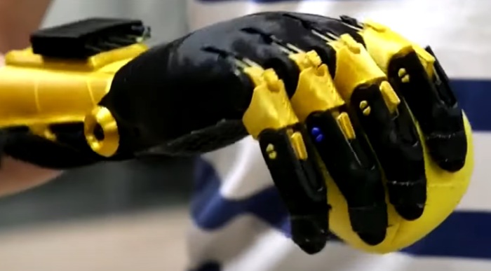 students build robotic hand for new classmate