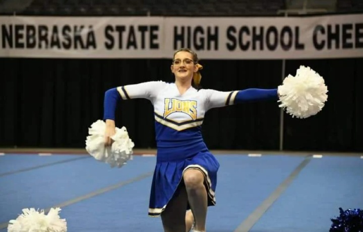 cheerleader performs by herself