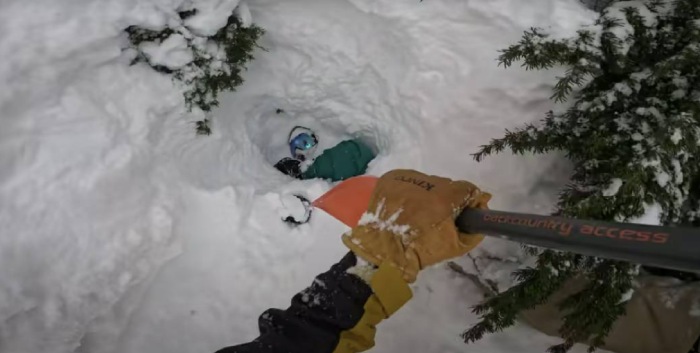 man saves snowboarder buried under snow