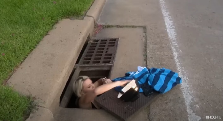 woman rescues puppies in sewers