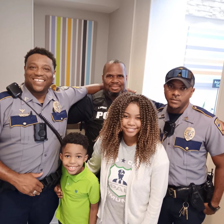 girl hugs police around country