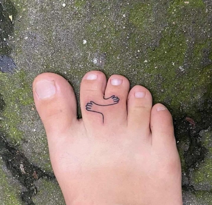webbed toes tattoo