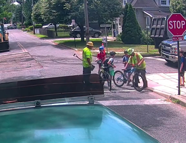 construction workers help boy bike crash