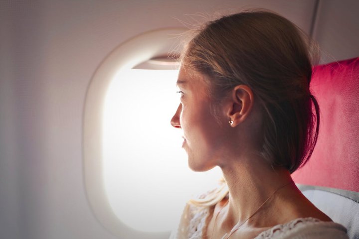 woman books row 1 airplane flight funny