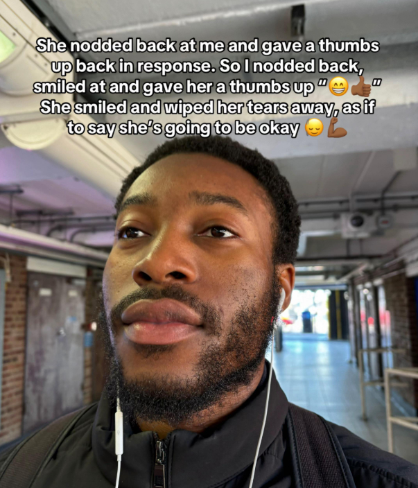 man shows kindness to woman crying on train