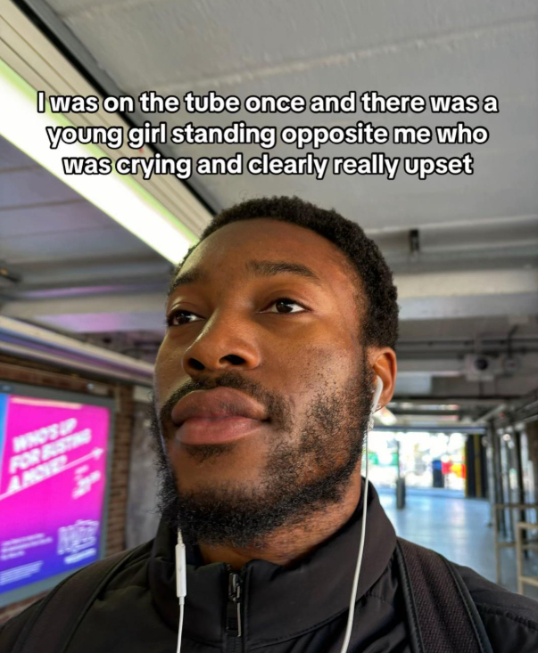 man shows kindness to woman crying on train