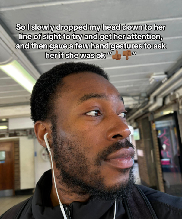 man shows kindness to woman crying on train