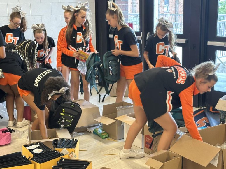community donates 500 backpacks to students in need