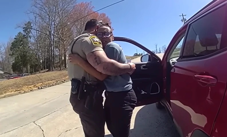 cop hugs struggling woman having bad day
