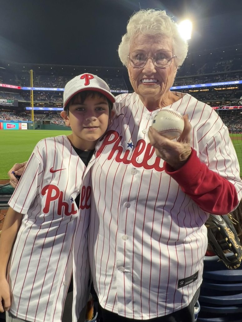 kid gives woman baseball Phillies game birthday