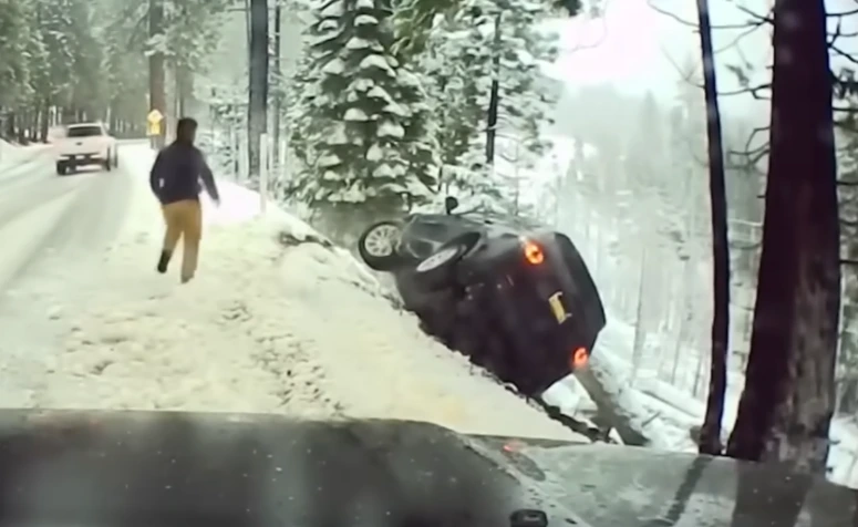 hero rescues passengers car crash snow highway 50